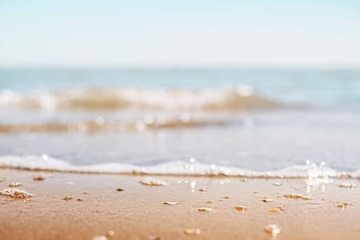 Closeup of sand on beach and blue summer sky. Panoramic beach landscape. Empty tropical beach and seascape
