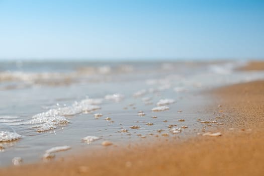 Closeup of sand on beach and blue summer sky. Panoramic beach landscape. Empty tropical beach and seascape