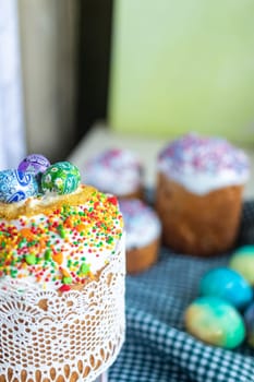 Easter cake with glace icing and colored easter eggs rustic style.