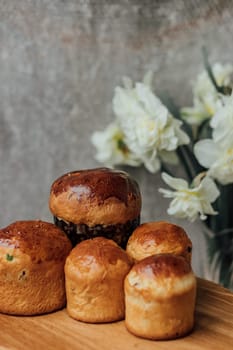 Delicious Easter cake and ingredients on wooden table