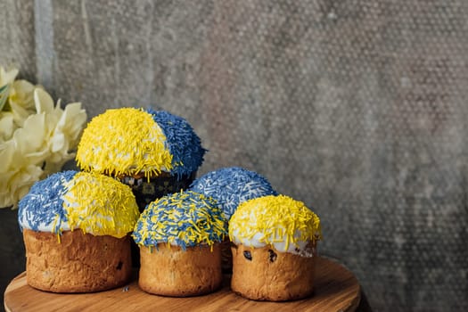 Delicious Easter cake and ingredients on wooden table.