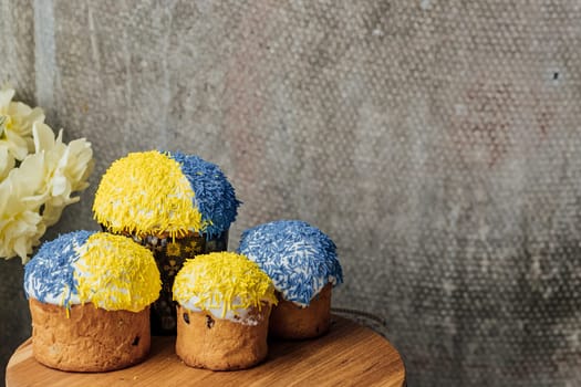 Delicious Easter cake and ingredients on wooden table.