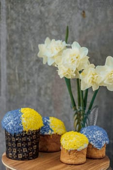 Delicious Easter cake and ingredients on wooden table.