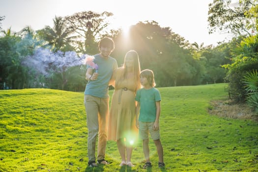 Pregnant mom, dad and son at the gender party on the golf course release pink smoke. Gender reveal announcement on the golf course. Loving family expecting baby girl. Happy moments.