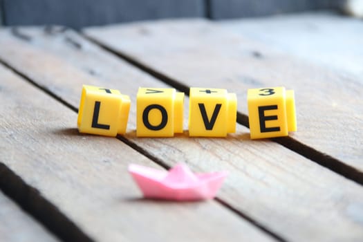 love concept. Greeting card with text on wooden background