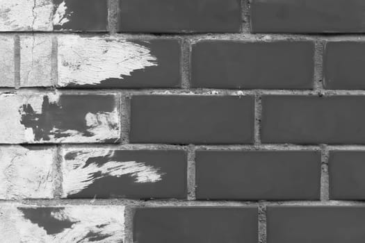 Brick old urban wall in grey dark and white light paint abstract brush design pattern street texture background.