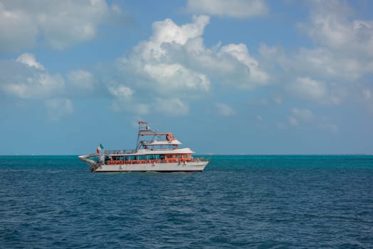 The boat in the Caribbean Sea on a sunny day. Clear water.