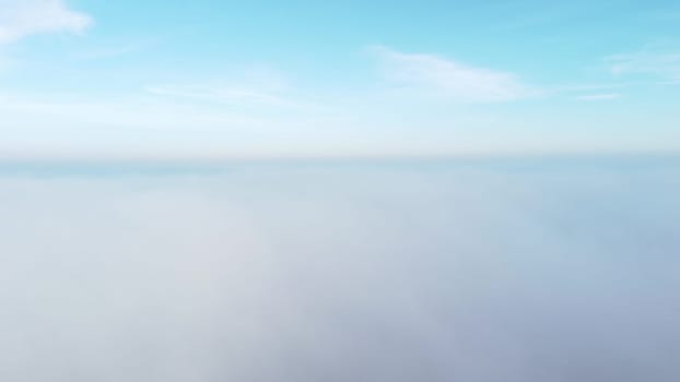 Sky clouds fog. Aerial drone view of blue sky and white clouds. Fog movement over city. View of fog from above and sky with clouds. View from above. Nature backdrop. Abstract natural background.