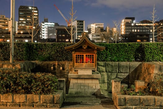 Small neighborhood shrine on quiet Kyoto street at night. High quality photo