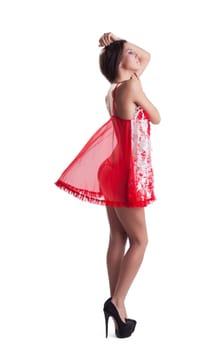 Sensual slim mosel posing in red negligee, isolated on white background