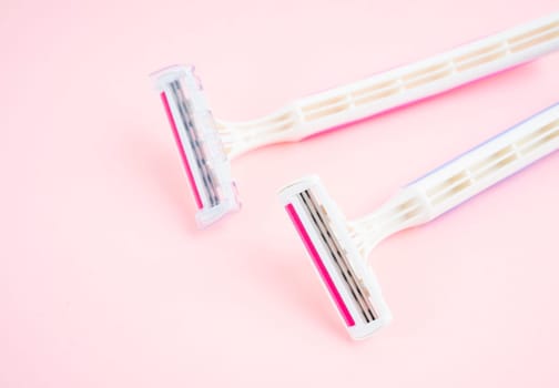 Pink Razors on pink color Background.