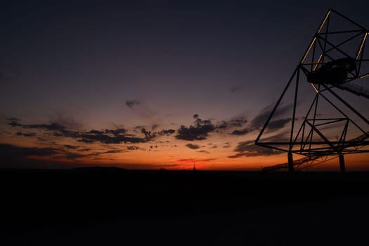 Viewing platform Tetraeder in Bottrop, Germany at sunset