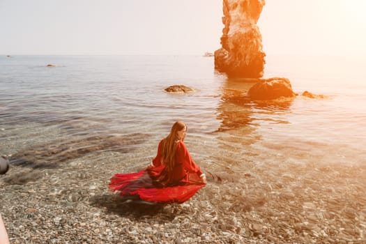 Woman travel sea. Happy tourist taking picture outdoors for memories. Woman traveler looks at the edge of the cliff on the sea bay of mountains, sharing travel adventure journey.