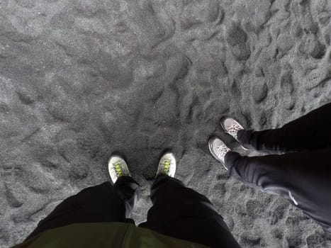 Hiking boots at Black Sand Beach Reynisfjara, Iceland
