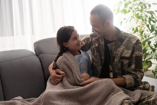 Handsome soldier reunited with family.