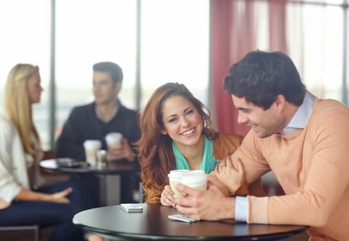 This best first date ever. A happy young couple on a date in a coffee shop