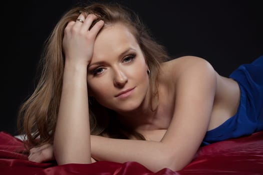 Portrait of sensual relaxed girl looking at camera, close-up
