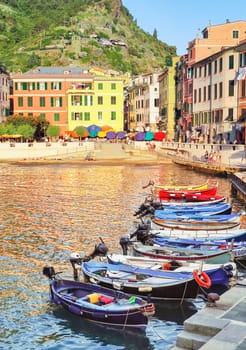 Travelogue of the Cinque Terre may be seen at the Ligurian tourist port of Vernazza with moored fishing boats.