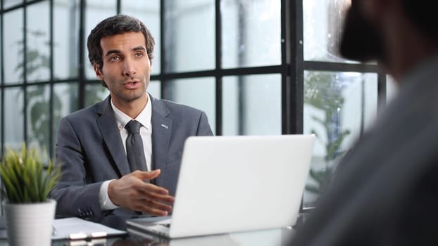 Meeting of business partners in the lobby of a modern office