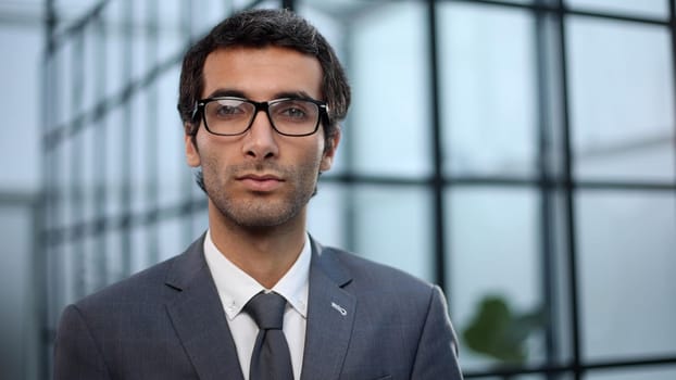 Successful businessman looking at camera with confidence