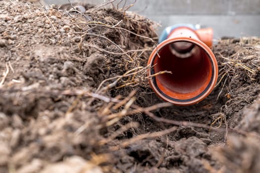 plastic pvc waste sewer pipe in the ground. High quality photo