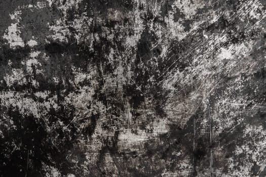 Black and white old grunge scratched metal surface steel background damaged outdated texture obsolete shabby.