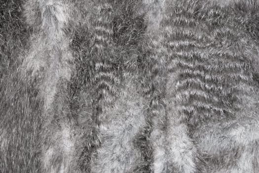 Faux fur grey wool abstract pattern nature skin soft warm fluffy background texture.