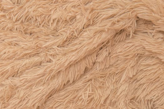 Brown beige fur wool abstract pattern nature skin soft warm fluffy background texture plaid.