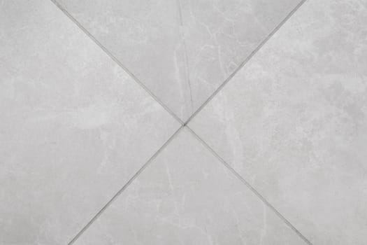 Light Grey White Marble Ceramic Floor Tile with Abstract Stone Pattern Surface Texture Background.