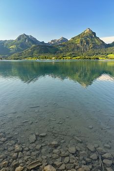 Beautiful landscape with lake and mountains in summer. Natural colorful background. Wolfgangsee lake in the Austrian applause.