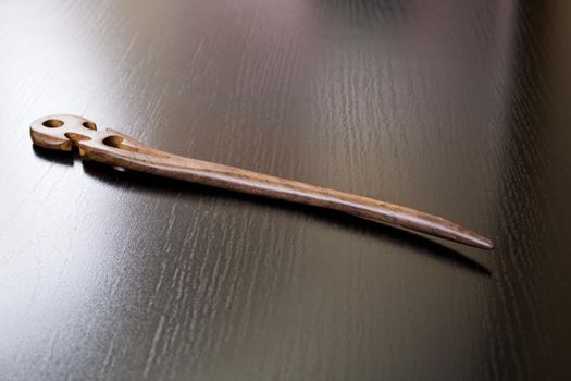 Wooden Japanese hair clip on a wooden table