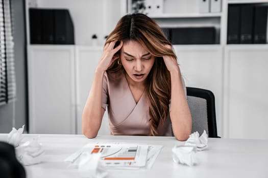 A competent female employee who has become completely exhausted as a result of overburdened work. Concept of unhealthy life as an office worker, office syndrome.