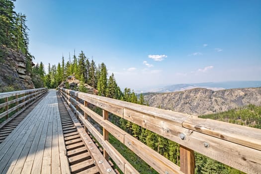 Old railroad bridge transformed to pedestrian pathway over Myra canyon in Okanagan valley