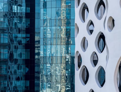 Detail of the facades of apartment blocks and towers in the Business Bay area of Dubai in UAE