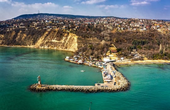 Aerial view from drone to the seacoast and the marina with boats and yachts. Sea landscape with yachts from the sea