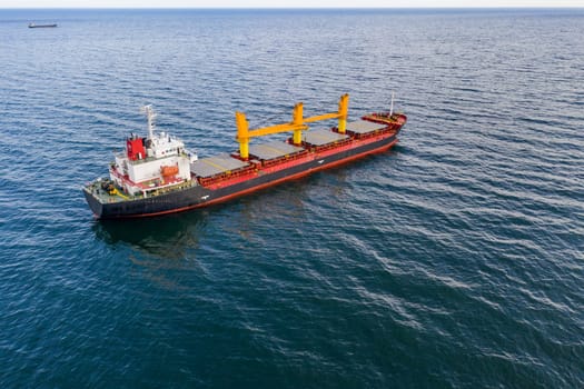 Large ship at sea. Aerial top view of cargo ship vessel import export sailing.