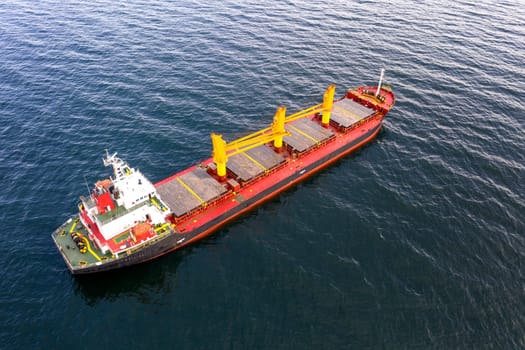 Large ship at sea. Aerial top view of cargo ship vessel import export sailing.