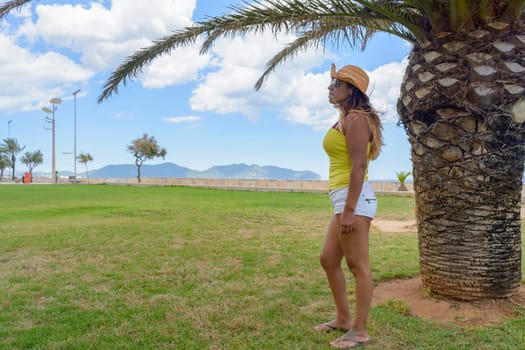 portrait of a latin woman smiling and posing on a warm spring and summer day,