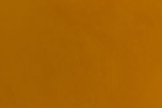 Mustard brown color wall texture blank background surface plaster abstract empty.