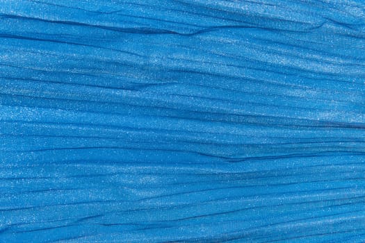 Velvet shiny silk fabric blue texture background material cloth soft abstract.