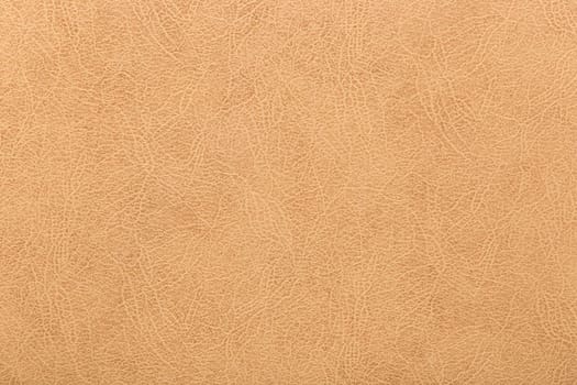 Light cracked skin surface retro texture material background warm color abstract leather pattern.