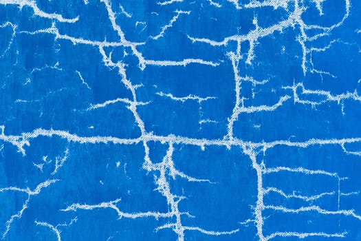 Old cracked surface blue crack concrete broken wall cement damaged background pattern.