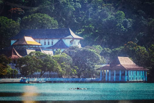 Vintage retro hipster style travel image of temple of the Tooth (Dalada Maligava) - very important Buddhist shrine with grunge texture overlaid. Kandy, Sri Lanka
