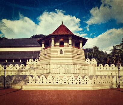 Vintage retro hipster style travel image of very important Buddhist shrine - Temple of the Tooth with grunge texture overlaid. Sri Lanka