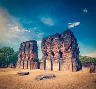 Vintage retro hipster style travel image of ancient Royal Palace ruins - UNESCO World Heritage Site. Polonnaruwa, Sri Lanka