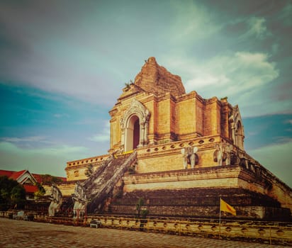 Vintage retro hipster style travel image of Buddhist temple Wat Chedi Luang. Chiang Mai, Thailand