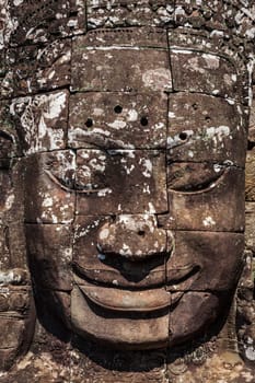 Ancient stone face of Bayon temple, Angkor, Cambodia