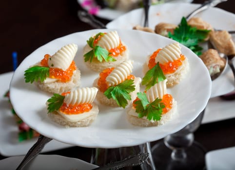 Image of fine sandwiches with red caviar, close-up