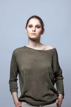 Portrait of slender model posing in modern clothes, close-up