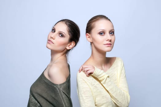 Young models posing in stylish casual clothes, close-up